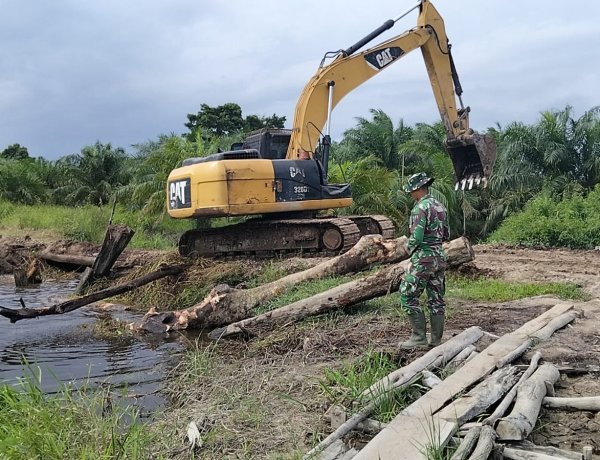 Sasaran Fisik TMMD Ke-129 Kodim 0313/KPR, Di Kebut Gunakan Alat Berat Untuk Peningkatan Badan Jalan 2.5 KM x 5 Meter